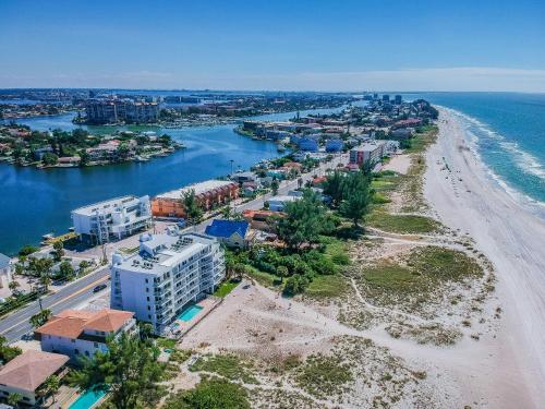 an aerial view of a beach and a city at Provident Oceana Beachfront Suites in St Pete Beach
