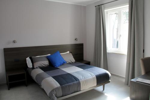 Postel nebo postele na pokoji v ubytování EasyRoom Frosinone - Casello Autostradale
