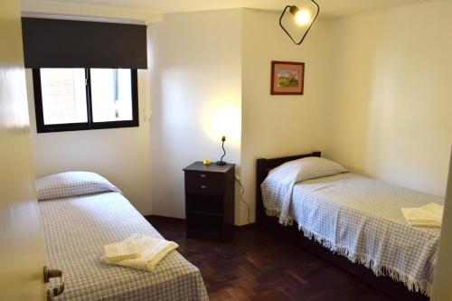 Ένα ή περισσότερα κρεβάτια σε δωμάτιο στο "Tu Lugar en el Norte" Dpto SADIMA - Barrio Norte