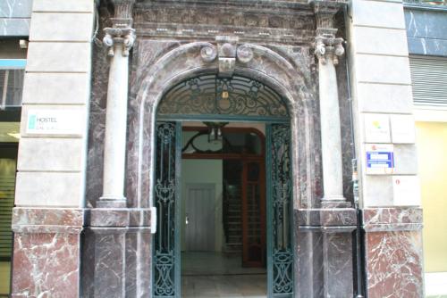 an entrance to a building with an ornate door at The Cathedral Hostel in Murcia