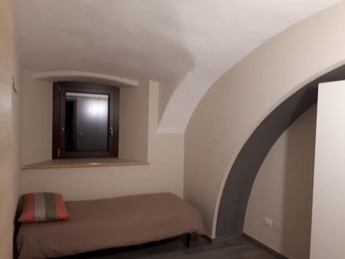 Ένα ή περισσότερα κρεβάτια σε δωμάτιο στο la Casa di FrAnto Appartamento