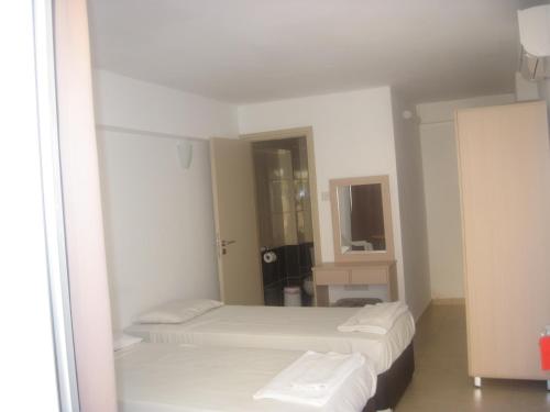 Ένα ή περισσότερα κρεβάτια σε δωμάτιο στο A.Maos Hotel Apartments 