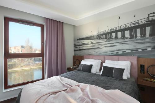 Säng eller sängar i ett rum på Apartament Przystań w Waterlane Island