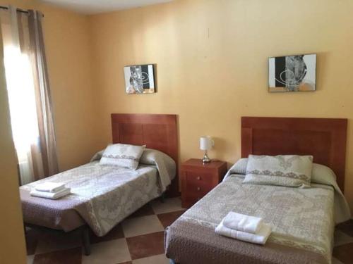 Ένα ή περισσότερα κρεβάτια σε δωμάτιο στο Villa La Quinta