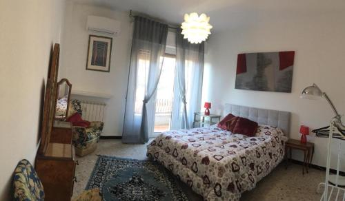 מיטה או מיטות בחדר ב-Alassio Mare e Non Solo 2