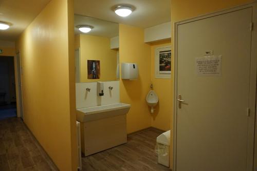 a bathroom with a sink and a toilet at Gîte des Grands Causses in Millau