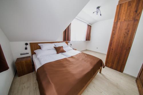 Postel nebo postele na pokoji v ubytování Apartmány Bílá 188