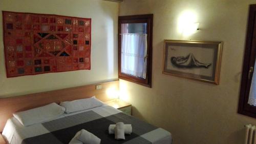Ένα ή περισσότερα κρεβάτια σε δωμάτιο στο San Marco Venice Apartment