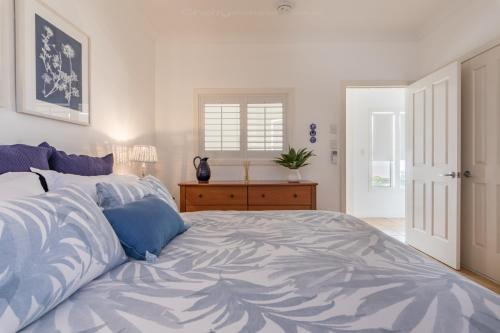 Ένα ή περισσότερα κρεβάτια σε δωμάτιο στο Moreton Bay Beach Lodge