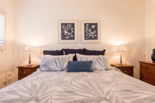 Ένα ή περισσότερα κρεβάτια σε δωμάτιο στο Moreton Bay Beach Lodge