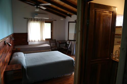 Tempat tidur dalam kamar di Piel de Timbó
