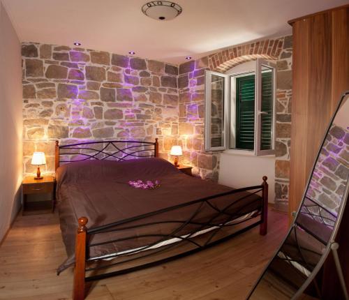 Postel nebo postele na pokoji v ubytování Casa Matošića Apartments