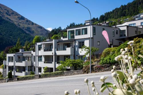 an apartment building on the side of a road at The Glebe Apartments in Queenstown