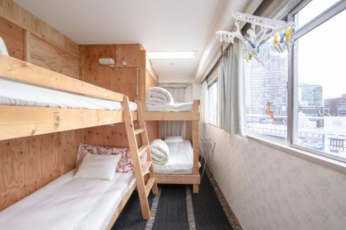 Postel nebo postele na pokoji v ubytování GUEST HOUSE B's FiveⅡ