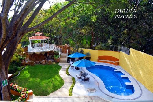Pemandangan kolam renang di Hotel Finca Los Cocos atau berdekatan