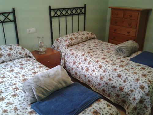 Postel nebo postele na pokoji v ubytování Casa Rosi. Cumbres borrascosas Brañuelas