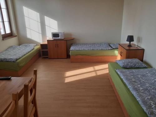 Postel nebo postele na pokoji v ubytování Penzion V Zatáčce