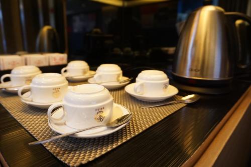 a group of cups and saucers on a counter at Metacity MK 名廸旺角 in Hong Kong
