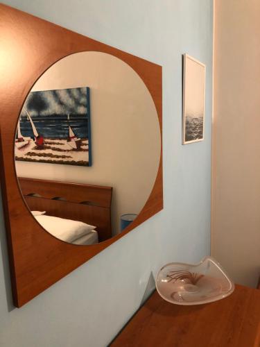 a mirror on a wall in a room at I Sentieri in Rio nellʼElba