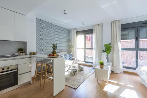 Η κουζίνα ή μικρή κουζίνα στο Horoko Apartments by gaiarooms