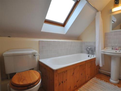 a bathroom with a toilet and a sink with a skylight at The Courthouse in Preston