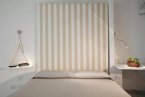 Postel nebo postele na pokoji v ubytování Hotel Mare Pineta
