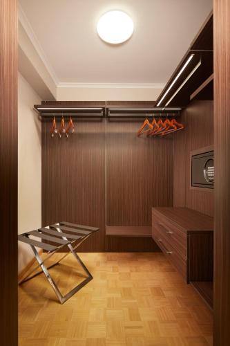 a walk in closet with a table in a room at HYPERION Hotel Berlin in Berlin