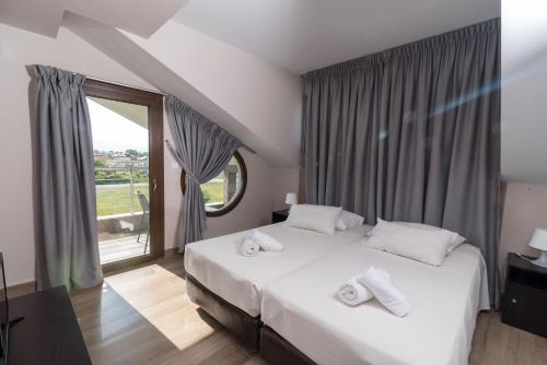 Postel nebo postele na pokoji v ubytování Principal New Leisure Hotel