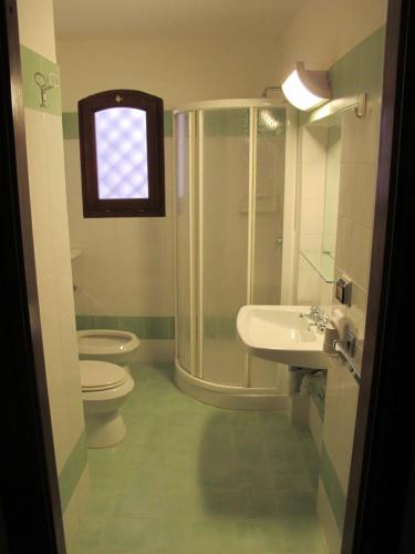 Ett badrum på Inter-Résidences Costa Smeralda
