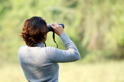 a woman taking a picture with a camera at Mahoora Yala - by Eco Team in Yala