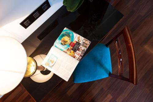 an overhead view of a magazine on a table at Bettoja Hotel Mediterraneo in Rome