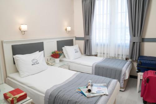 Ліжко або ліжка в номері Hotel Agan Oldcity Istanbul