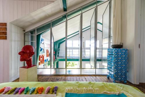 a room with a bed and a large window at Lådfabriken in Edshultshall