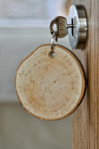 a wooden door with a lock on it at The Swallows Rest Bed & Breakfast in Brigstock