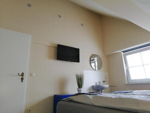 TV a/nebo společenská místnost v ubytování Janinas Loft