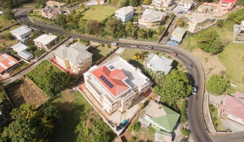 an overhead view of a house with a road at Calliandras Apartment Complex in Kingstown