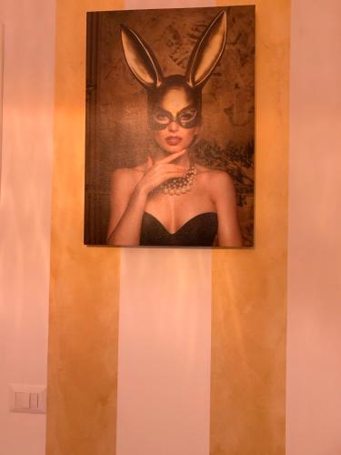 a painting of a woman with bunny ears on her head at FiumicinoA57 in Fiumicino