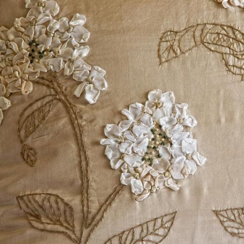 a close up of white flowers on a table at The Swallows Rest Bed & Breakfast in Brigstock