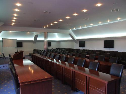 a conference room with desks and chairs in it at Monterai Resort in Poiana Brasov