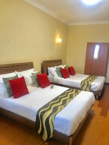Ένα ή περισσότερα κρεβάτια σε δωμάτιο στο Hôtel Sky blue Mada