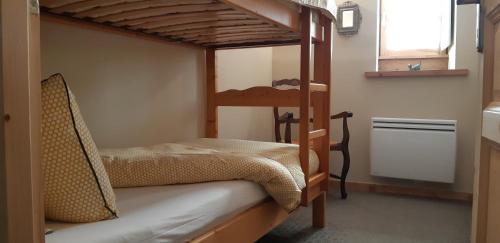a bedroom with two bunk beds in a room at Près des Forts in Briançon