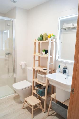 a bathroom with a sink and a toilet and a shower at Ekilore - Basquenjoy in Hondarribia