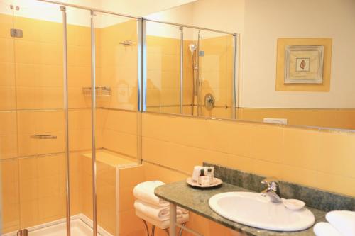 a bathroom with a sink and a shower at Villa Agnese in Sestri Levante