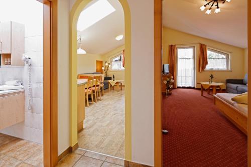 a room with a kitchen and a living room at Appartment Kinigadner in Pertisau