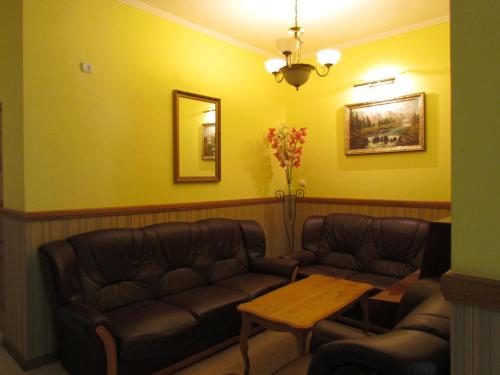 a waiting room with a couch and a table at Lemon in Drohobytsch