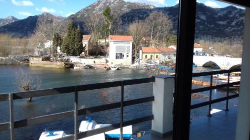 a view of a river from a window at Lux Apartment Sunset in Virpazar