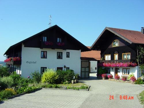 a large white building with a black roof at Giglerhof in Bad Birnbach