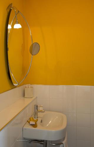 a bathroom with a sink and a mirror at Ristolocanda Grani Di Pepe in Flaibano