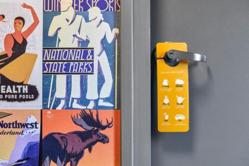 a door with a sign on it next to a door at hotelF1 Bordeaux Ville in Bordeaux