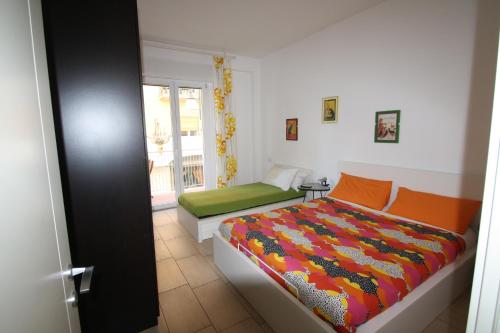 a bedroom with a bed and a window at Appartamenti Giusy e Giusy 2 in Sorrento